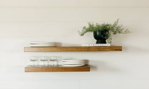 Deep Floating Wooden Shelves - holding planter and dishware