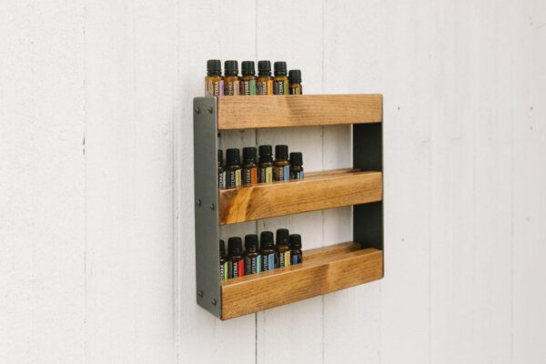 Essential Oil Wall Display with 3 essential oil racks holding various essential oils