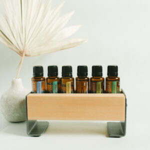 small wood essential oil tray holding 6 essential oil bottles