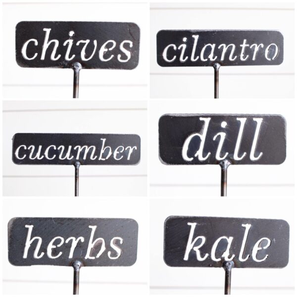 6 different metal garden stakes that read: chives, cilantro, cucumber, dill, herbs, and kale