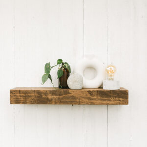 mini floating shelf holding small houseware items